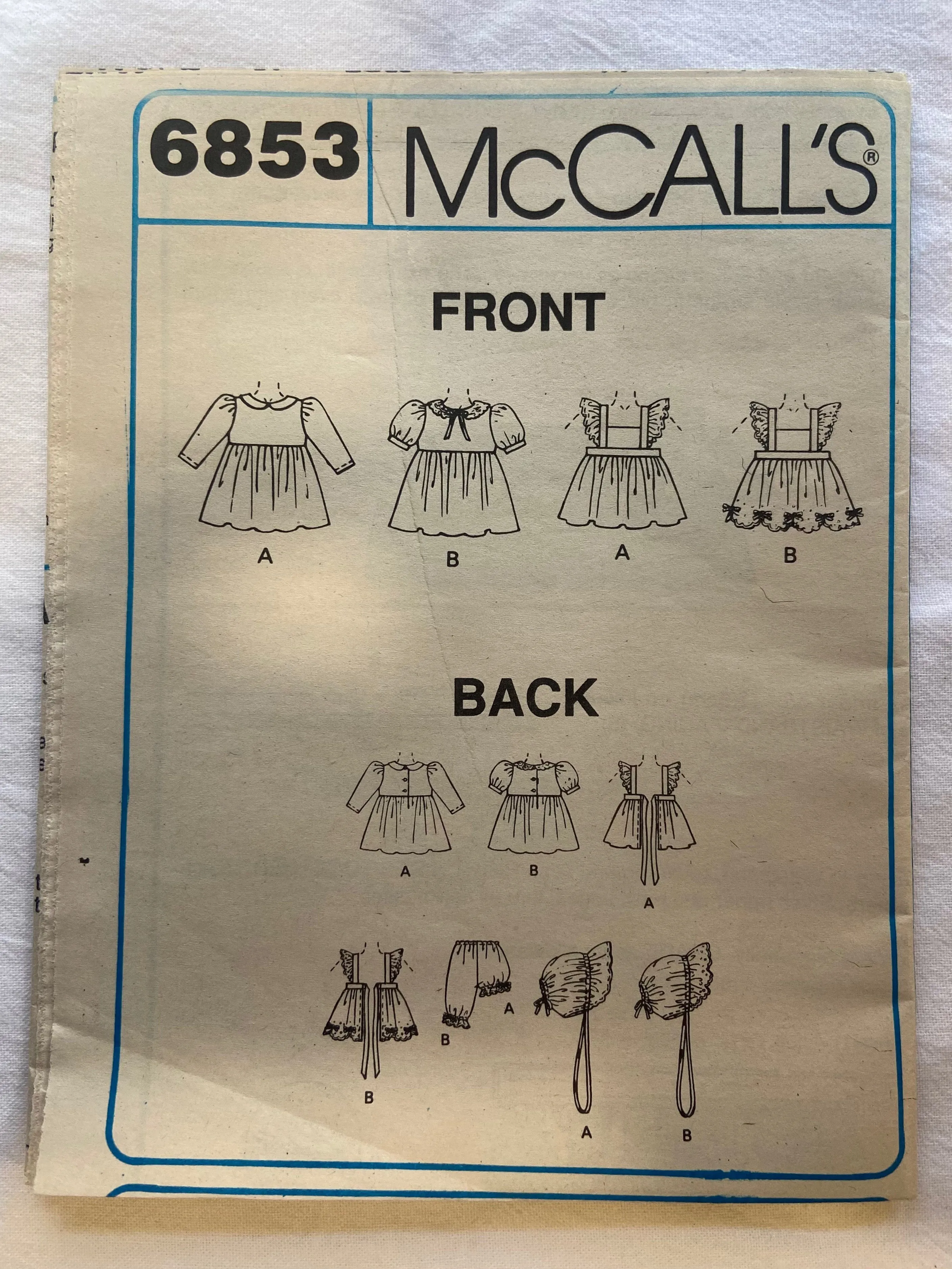 McCall's 6853 Pattern UNCUT Infants' Pinafore, Dress, Panties, Pantaloons, & Bonnet S/M/L/XL